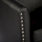 Sillón individual tipo barril de piel sintética con detalles de tachuelas