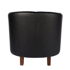 Sillón individual tipo barril de piel sintética con detalles de tachuelas